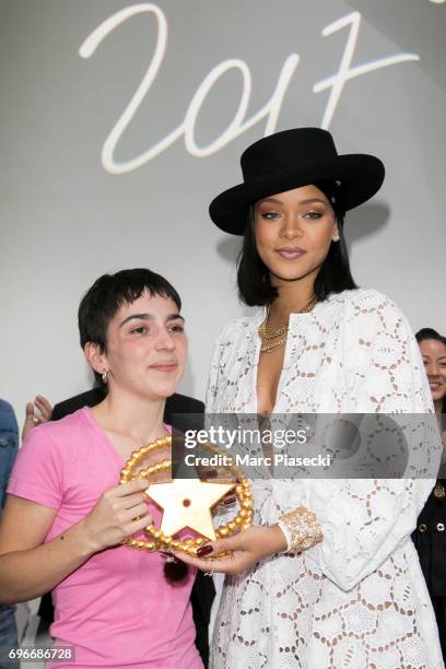 Winner of the 'Young Fashion Designer' LVMH Prize 2017, Stylist Marine Serre poses with singer Rihanna during the 'Young Fashion Designer' : LVMH...