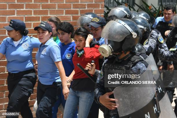 Students of the National Autonomous University of Honduras are arrested following clashes during a protest against the arrest of fellow students for...