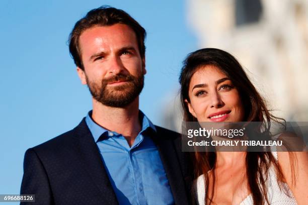 French actors Fanny Valette and Amaury de Crayencour pose on the red carpet on June 16, 2017 during the Cabourg Romantic Film Festival in Cabourg,...