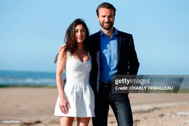 French actors Amaury de Crayencour and Fanny Valette pose during a photocall on June 16, 2017 at the Cabourg Romantic Film Festival in Cabourg,...