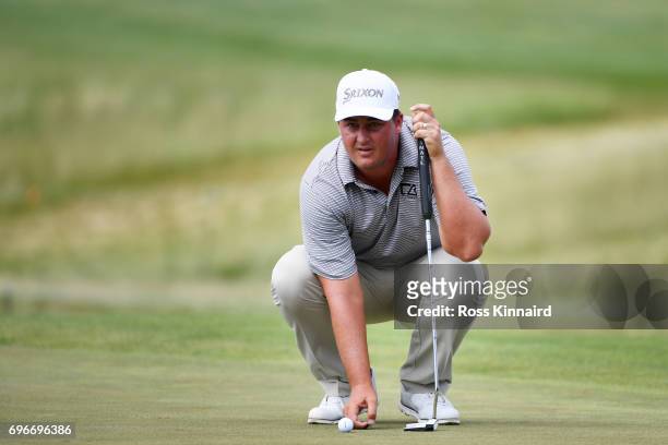 Michael Putnam of the United States lines up a putt on the ninth green during the second round of the 2017 U.S. Open at Erin Hills on June 16, 2017...