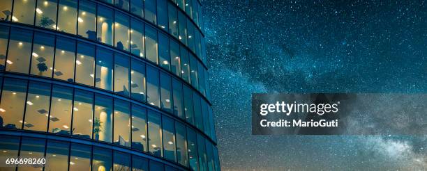 office building at night - skyscraper night stock pictures, royalty-free photos & images