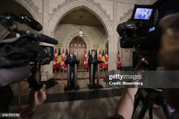 Justin Trudeau, Canada's prime minister, right, speaks while Charles Michel, Belgium's prime minister, listens during a joint press conference in...