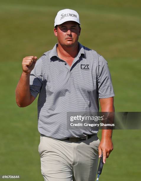 Michael Putnam of the United States reacts after making a birdie on the 12th green during the second round of the 2017 U.S. Open at Erin Hills on...