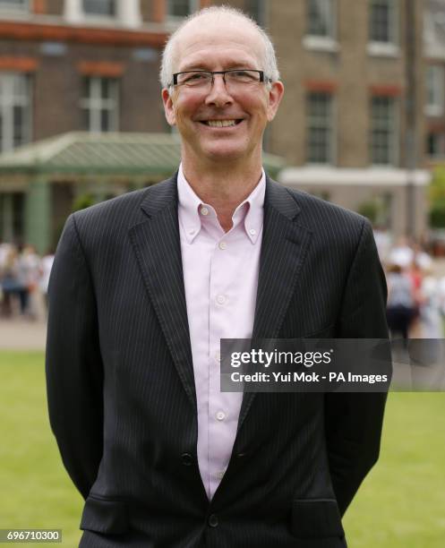 John Binns, who has been awarded an MBE in the Queen's Birthday Honours List, outside Kensington Palace, London.