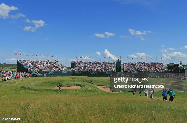 Jordan Spieth of the United States, Dustin Johnson of the United States, and Martin Kaymer of Germany walk to the ninth green during the second round...