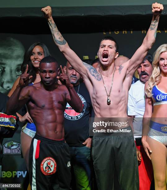 Super bantamweight champion Guillermo Rigondeaux and boxer Moises Flores pose during their official weigh-in at the Mandalay Bay Events Center on...