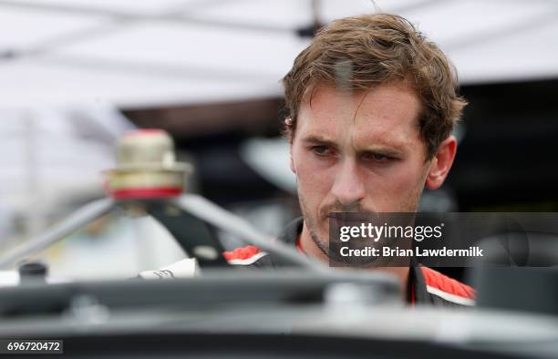 Ben Kennedy, driver of the Weber Chevrolet, looks on during practice for the NASCAR XFINITY Series Irish Hills 250 at Michigan International Speedway...