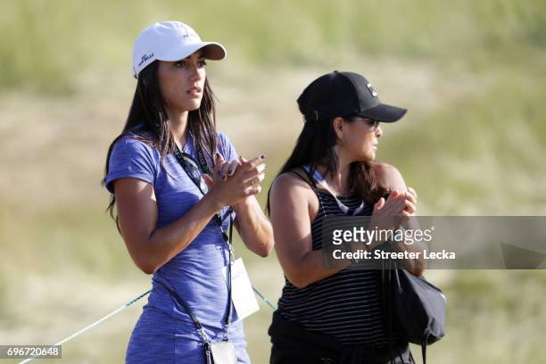 Allison Stokee and Lynn Fowler, mother of Rickie Fowler, look on during the second round of the 2017 U.S. Open at Erin Hills on June 16, 2017 in...