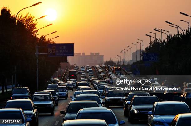 traffic jam during sunset - traffic stock pictures, royalty-free photos & images