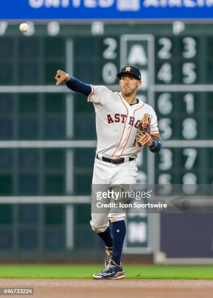 Houston Astros shortstop Carlos Correa fields the ball during the MLB game between the Texas Rangers and Houston Astros on June 14, 2017 at Minute...