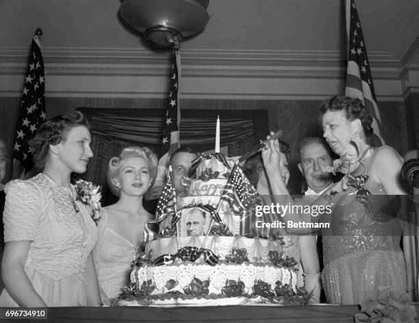 Highlights of the President's birthday celebration in Washington was cutting of the giant cake by Mrs. Franklin D. Roosevelt. Left to right: Anna...