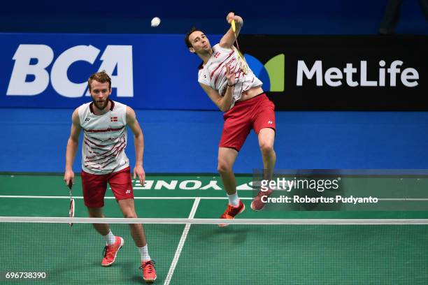 Mathias Boe and Carsten Mogensen of Denmark compete against Vladimir Ivanov and Ivan Sozonov of Russia during Mens Double Quarterfinal match of the...