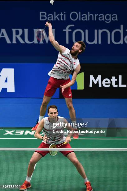 Mathias Boe and Carsten Mogensen of Denmark compete against Vladimir Ivanov and Ivan Sozonov of Russia during Mens Double Quarterfinal match of the...