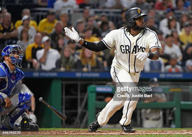 Josh Bell of the Pittsburgh Pirates hits a 2 run RBI triple to right field in the sixth inning during the game against the Chicago Cubs at PNC Park...