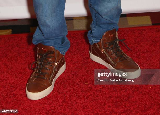 Former NFL player Lawyer Milloy, shoes detail, attends the Raising the Stakes Celebrity Charity Poker Tournament benefiting the One Step Closer...