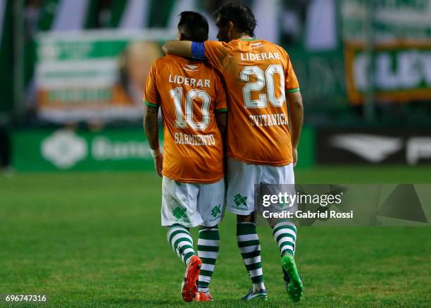 Brian Sarmiento of Banfield celebrates with teammate Dario Cvitanich after scoring the second goal of his team during a match between Banfield and...