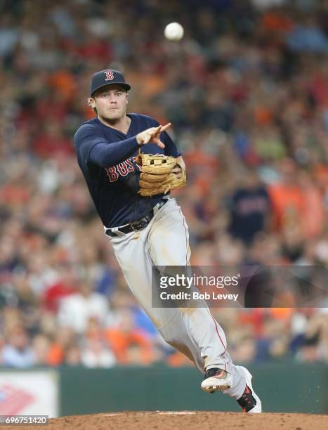 Josh Rutledge of the Boston Red Sox throws to first base against the Houston Astros at Minute Maid Park on June 16, 2017 in Houston, Texas.