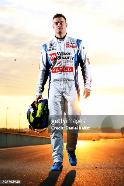 James Moffat driver of the Wilson Security Racing GRM Holden Commodore VF poses for a portrait prior to practice 3 for the Darwin Triple Crown, which...
