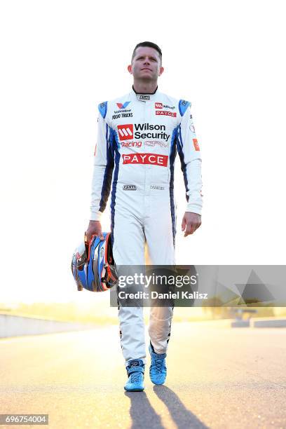 Garth Tander driver of the Wilson Security Racing Holden Commodore VF poses for a portrait prior to practice 3 for the Darwin Triple Crown, which is...