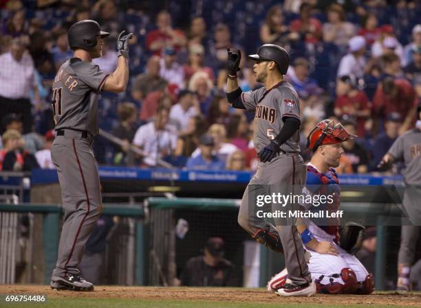 Gregor Blanco of the Arizona Diamondbacks celebrates with Jeremy Hazelbaker after hitting a two run home run in the top of the seventh inning at...