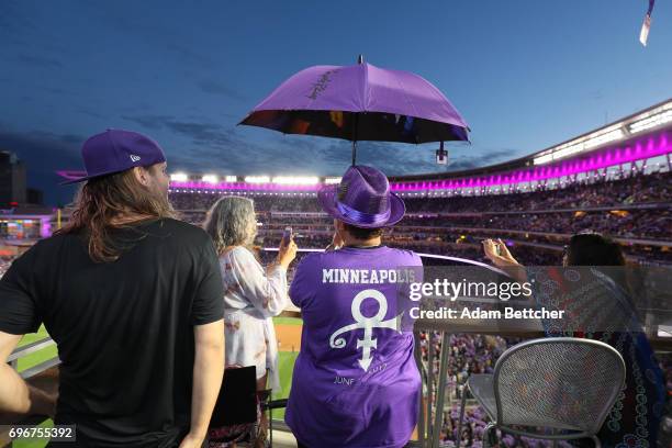 Omarr Baker helps celebrate "Prince Night" at Target Field, a tribute to Minneapolis' own late musician organized by home team Minnesota Twins on...