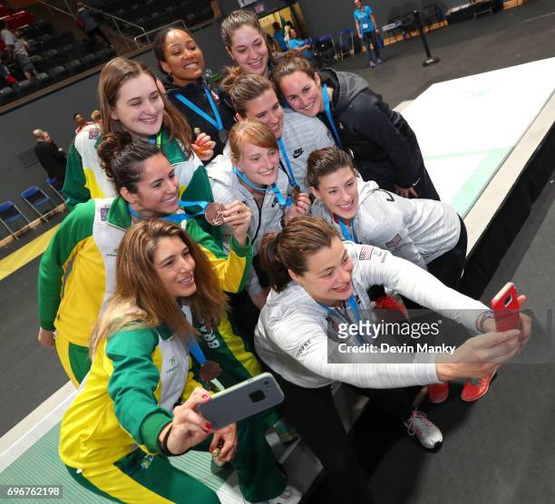 The medal winners of the Team Women's Epee event from Brazil, USA and Canada pose for a selfie on the podium on June 16, 2017 at the Pan-American...