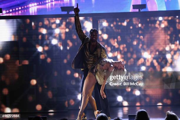 Rashad Jennings and Emma Slater perform at the Dancing With The Stars Hot Summer Nights Tour at Caesars Atlantic City on June 17, 2017 in Atlantic...