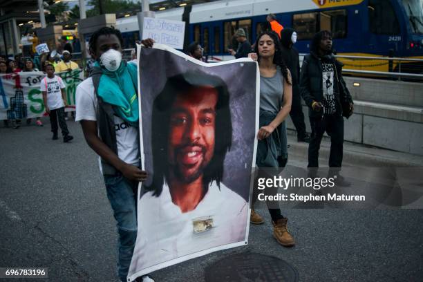 Protestors carry a portrait of Philando Castile on June 16, 2017 in St Paul, Minnesota. Protests erupted in Minnesota after Officer Jeronimo Yanez...