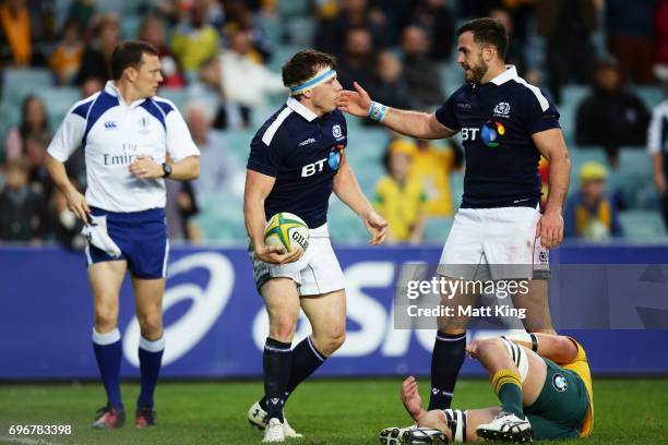 Hamish Watson of Scotland celebrates with Alex Dunbar of Scotland after scoring a try during the International Test match between the Australian...