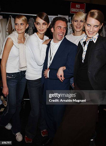Actor David Eigenberg pose with models at the Luca Luca Fashion Show February 12, 2002 in New York City.