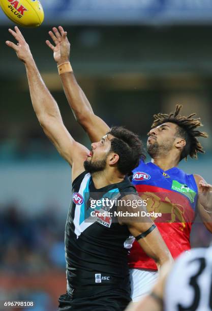 Archie Smith of the Lions and Patrick Ryder of the Power compete for the ball during the round 13 AFL match between the Port Adelaide Power and the...