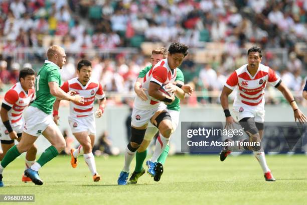 Yoshitaka Tokunaga of Japan runs with the ball during the international rugby friendly match between Japan and Ireland at Shizuoka Stadium on June...