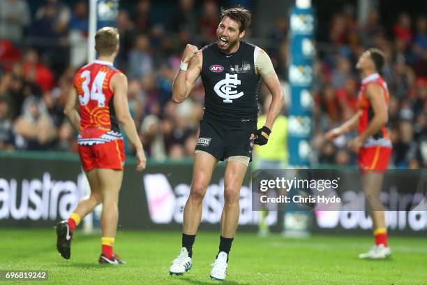 Dale Thomas of the Blues celebrates a goal during the round 13 AFL match between the Gold Coast Suns and the Carlton Blues at Metricon Stadium on...