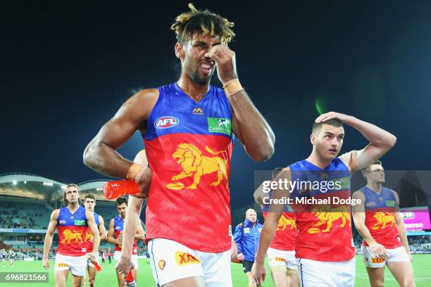 Archie Smith and Tom Rockliff of the Lions looks dejected after defeat during the round 13 AFL match between the Port Adelaide Power and the Brisbane...