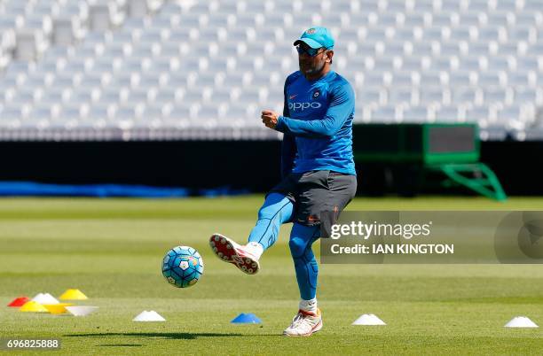 India's MS Dhoni attends a nets practice session at The Oval in London on June 17 on the eve of the ICC Champions Trophy Final cricket match between...