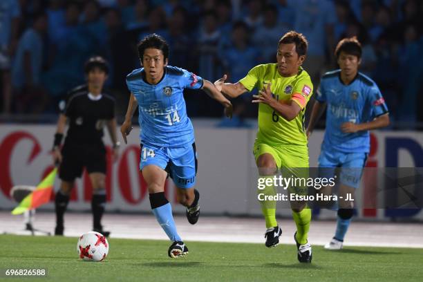 Kengo Nakamura of Kawasaki Frontale and Toshihiro Aoyama of Sanfrecce Hiroshima compete for the ball during the J.League J1 match between Kawasaki...