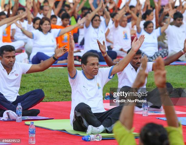 Sri Lankan president Maithripala Sirisena performs Yoga during an event to mark the International Yoga Day at the Independence Square, Colombo, Sri...