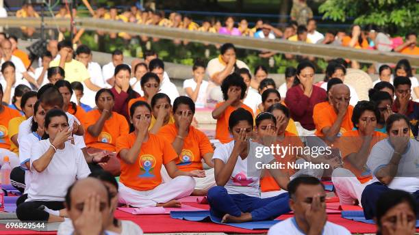 Sri Lankan participants perform Yoga during an event to mark the International Yoga Day at the Independence Square, Colombo, Sri Lanka on Saturday 17...