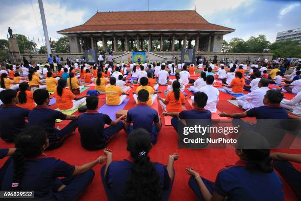 Sri Lankan participants perform Yoga during an event to mark the International Yoga Day at the Independence Square, Colombo, Sri Lanka on Saturday 17...