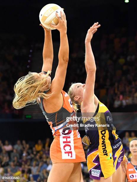 Susan Pettitt of the Giants and Laura Langman of the Lightning challenge for the ball during the Super Netball Grand Final match between the...