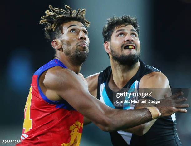 Archie Smith of the Lions and Patrick Ryder of the Power compete for the ball during the round 13 AFL match between the Port Adelaide Power and the...