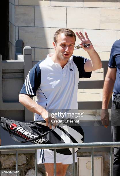French President Emmanuel Macron leaves his house dressed for tennis on the eve of the second round of the French parliamentary elections on June 17,...