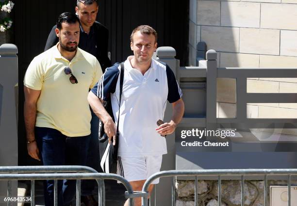 French President Emmanuel Macron leaves his house dressed for tennis with his deputy chief of staff Alexandre Benalla on the eve of the second round...