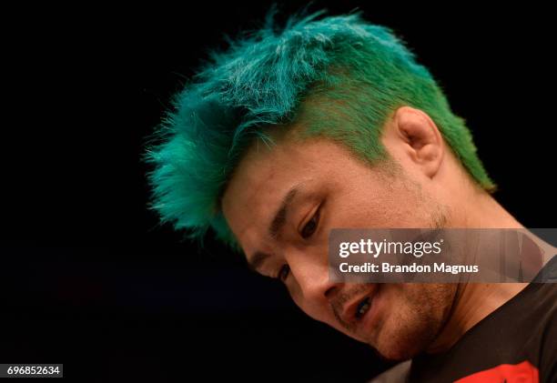 Takanori Gomi of Japan reacts after his submission loss to Jon Tuck of Guam in their lightweight bout during the UFC Fight Night event at the...