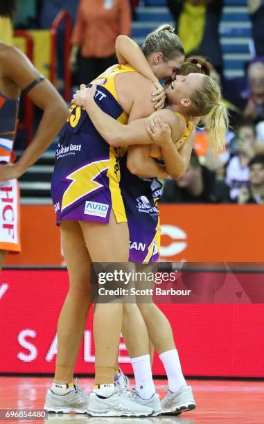 Caitlin Bassett, Laura Langman and Kelsey Browne celebrate victory with their teammates at the final whistle during the Super Netball Grand Final...