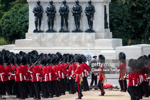 Guardsman lies on a stretcher after fainting during the annual Trooping The Colour parade in Horse Guards Parade on June 17, 2017 in London, England....