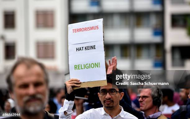 Protesters demonstrating against the Terror at a Muslims March on June 17, 2017 in Cologne, Germany. The event takes place under the motto "Not with...