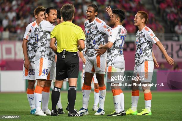 Shimizu S-Pulse players surround referee Nobutsugu Murakami after Cerezo Osaka is awarded a penalty due to a hand ball by Ko Matsubara of Shimizu...