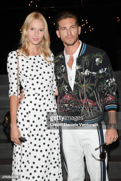 Adriana Cernanova and Adam Senn attend the Dolce & Gabbana show during Milan Men's Fashion Week Spring/Summer 2018 on June 17, 2017 in Milan, Italy.